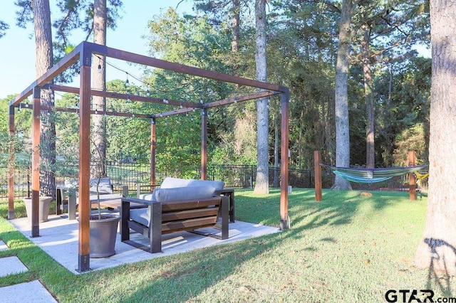 exterior space featuring fence, an outdoor living space, a patio, and a yard