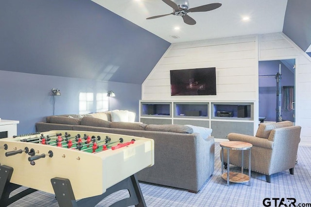 recreation room featuring ceiling fan, visible vents, and vaulted ceiling