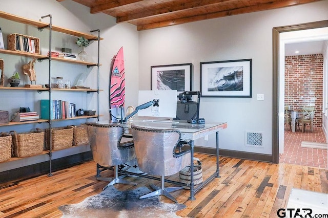 home office with wooden ceiling, visible vents, baseboards, beam ceiling, and light wood finished floors