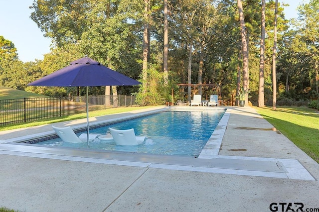 view of swimming pool featuring a lawn, a patio area, fence, and a fenced in pool