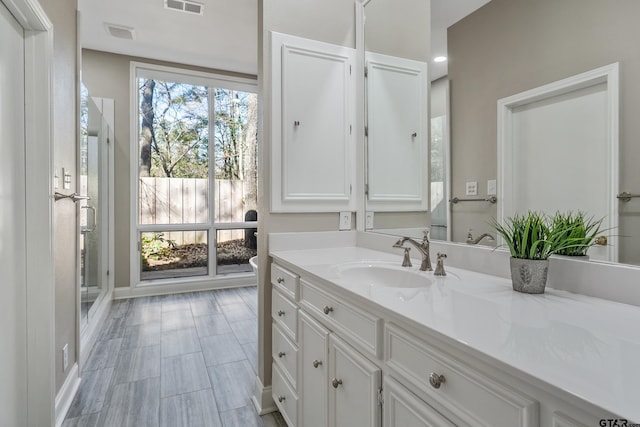 bathroom featuring visible vents and vanity