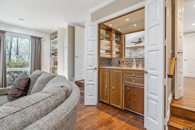 bar featuring ornamental molding, recessed lighting, and dark wood-style floors