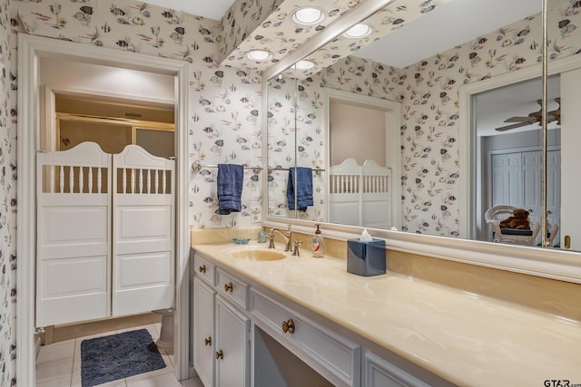 full bathroom featuring vanity, tile patterned floors, a ceiling fan, and wallpapered walls