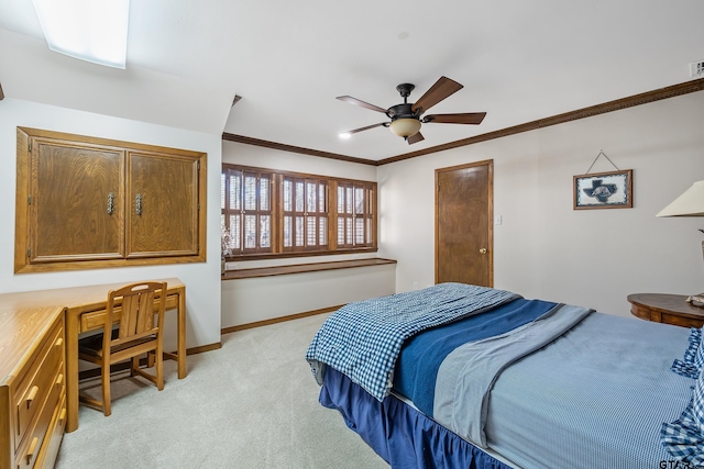 bedroom featuring light carpet, visible vents, baseboards, built in desk, and crown molding