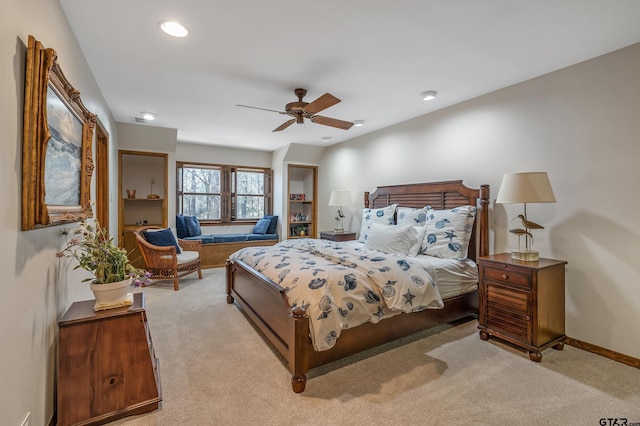 bedroom featuring light carpet, ceiling fan, baseboards, and recessed lighting