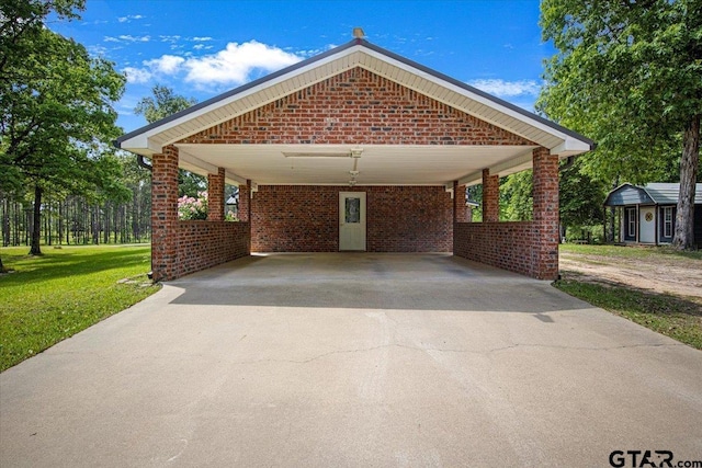 ranch-style home featuring brick siding, driveway, a front lawn, and a carport