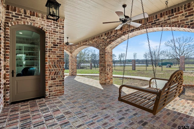 view of patio featuring ceiling fan