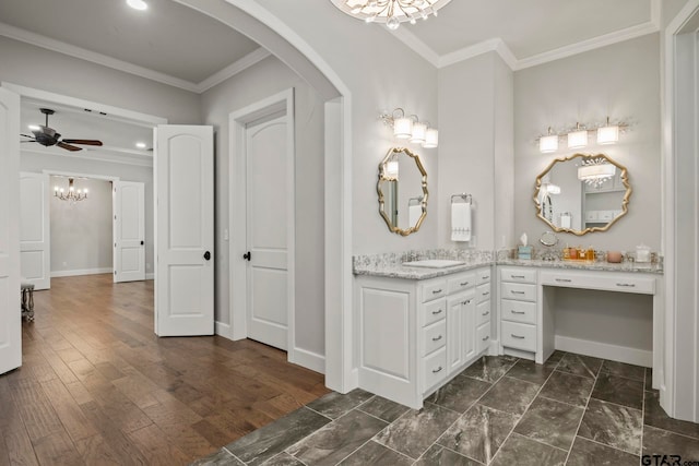 bathroom featuring ceiling fan, wood-type flooring, vanity, and crown molding