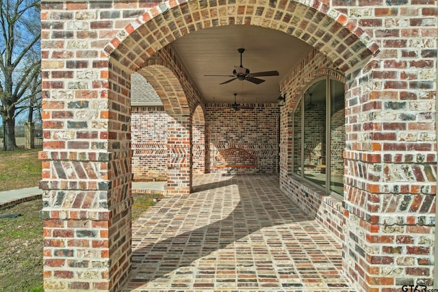 view of patio featuring ceiling fan