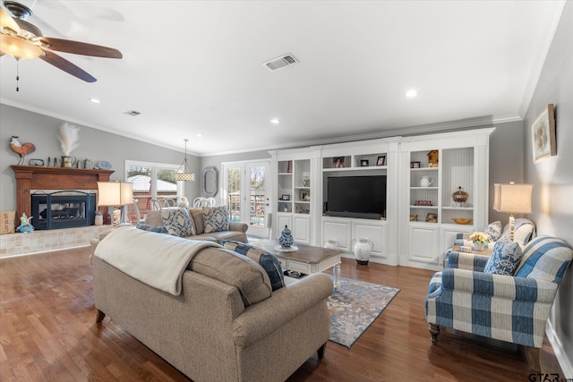 living room with ceiling fan, crown molding, and dark hardwood / wood-style floors