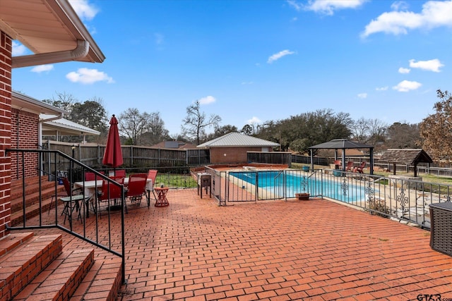 view of swimming pool featuring a patio area and a gazebo