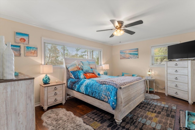 bedroom with crown molding, dark hardwood / wood-style floors, and ceiling fan