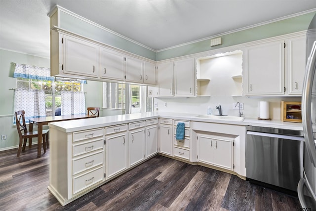 1723 Kensington Dr, Tyler, TX 75703 - kitchen with dishwasher, a sink, crown molding, light countertops, and dark wood-style floors
