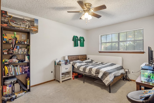 802 Carriage Dr, Tyler, TX 75703 - bedroom with carpet flooring, a textured ceiling, and a ceiling fan