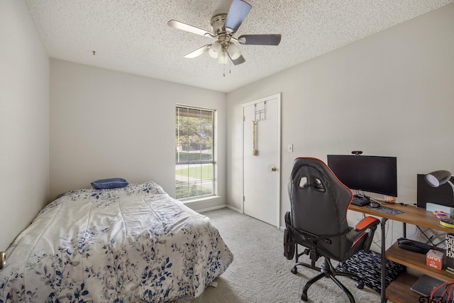 802 Carriage Dr, Tyler, TX 75703 - bedroom with carpet, a textured ceiling, an office area, and a ceiling fan