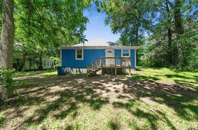 230 N Henderson St, Rusk, TX 75785 - rear view of house featuring a yard, a deck, and stairs