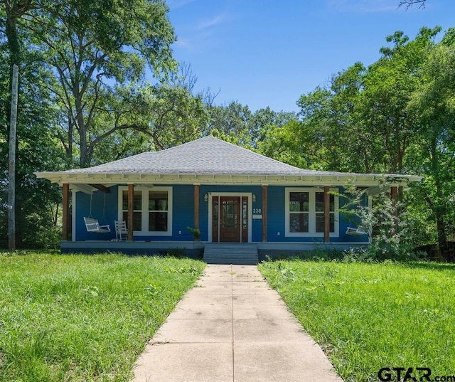 230 N Henderson St, Rusk, TX 75785 - bungalow-style house featuring covered porch and a shingled roof