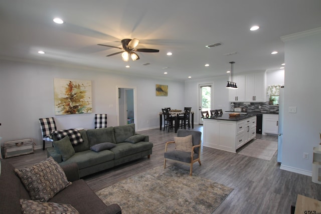 19379 Cedarpark Pl, Lindale, TX 75771 - living area featuring ceiling fan, dark wood-type flooring, recessed lighting, and ornamental molding