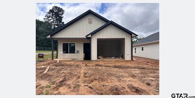 388 Alexander St, Kilgore, TX 75662 - view of front of house with board and batten siding