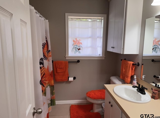 full bath featuring vanity, tile patterned flooring, baseboards, and toilet