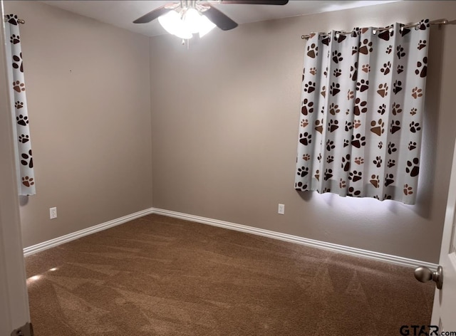 unfurnished room with carpet floors, baseboards, and a ceiling fan