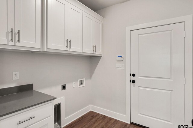 laundry area featuring hookup for a washing machine, dark wood-type flooring, cabinets, and electric dryer hookup