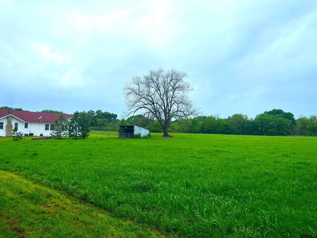 205 N Sixth St, Mexia, TX 76667 - view of grassy yard with an outdoor structure and a view of countryside