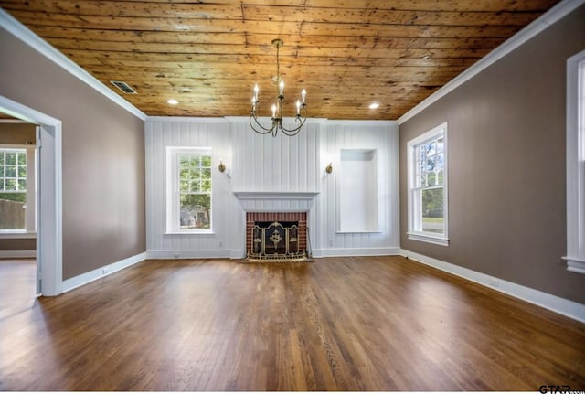 705 S Vine Ave, Tyler, TX 75701 - unfurnished living room with wooden ceiling, wood finished floors, crown molding, a chandelier, and a brick fireplace