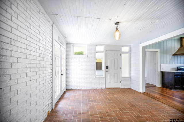 705 S Vine Ave, Tyler, TX 75701 - entrance foyer with brick wall and brick flooring