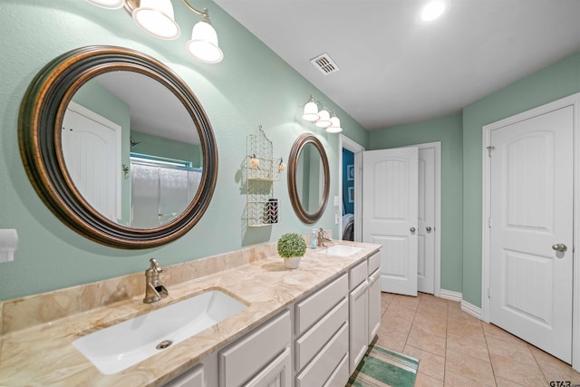 2531 Guinn Farms Rd, Tyler, TX 75707 - full bath with double vanity, tile patterned floors, and baseboards