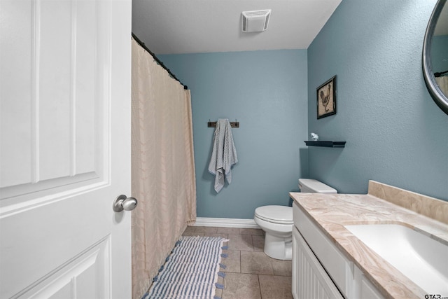 2531 Guinn Farms Rd, Tyler, TX 75707 - bathroom featuring toilet, tile patterned floors, vanity, and baseboards