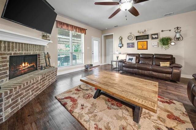 2531 Guinn Farms Rd, Tyler, TX 75707 - living room featuring ceiling fan, wood finished floors, a fireplace, and baseboards