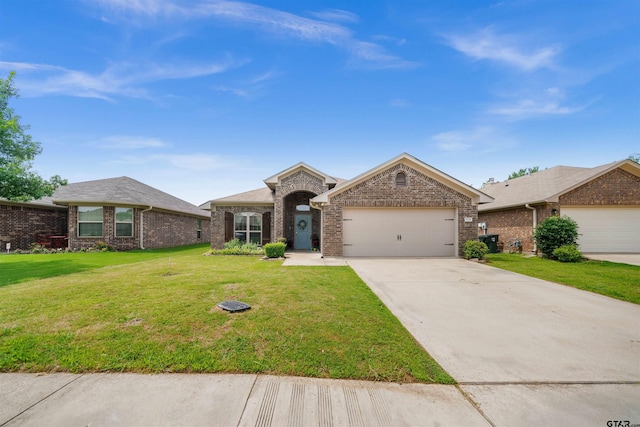 2531 Guinn Farms Rd, Tyler, TX 75707 - view of front of home with an attached garage, concrete driveway, brick siding, and a front yard
