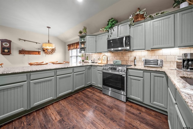 2531 Guinn Farms Rd, Tyler, TX 75707 - kitchen featuring gray cabinetry, stainless steel appliances, vaulted ceiling, decorative backsplash, and open shelves