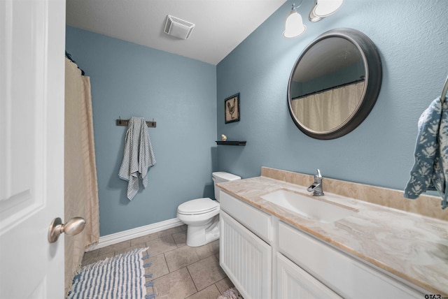 2531 Guinn Farms Rd, Tyler, TX 75707 - bathroom featuring toilet, vanity, and baseboards