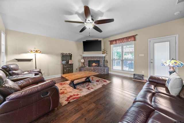 2531 Guinn Farms Rd, Tyler, TX 75707 - living room featuring a ceiling fan, wood finished floors, a brick fireplace, and baseboards