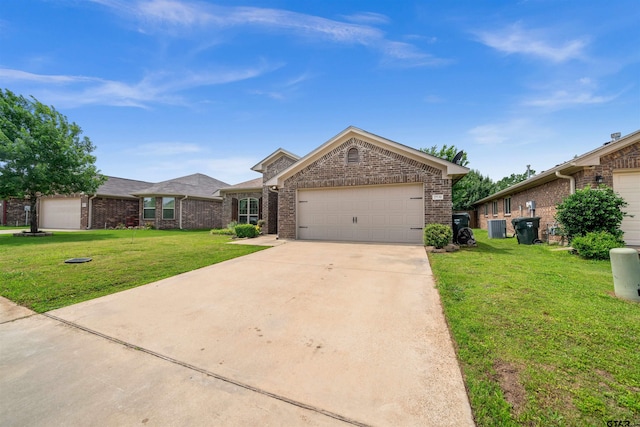 2531 Guinn Farms Rd, Tyler, TX 75707 - view of front of property featuring brick siding, a front yard, driveway, an attached garage, and central air condition unit