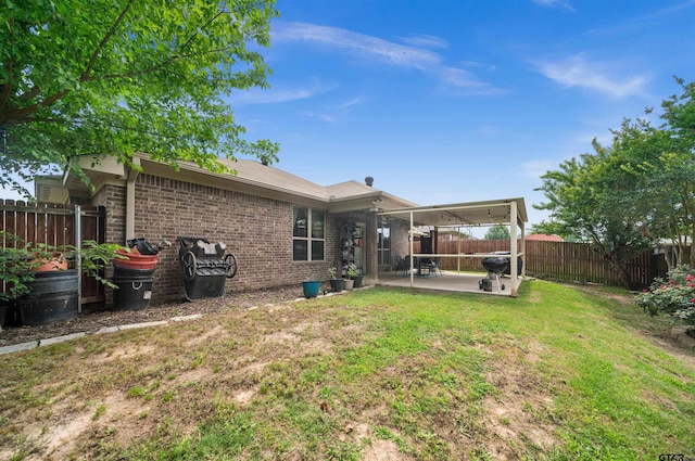 2531 Guinn Farms Rd, Tyler, TX 75707 - back of property featuring a patio and brick siding