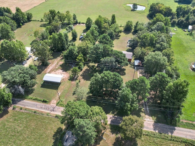 birds eye view of property featuring a rural view