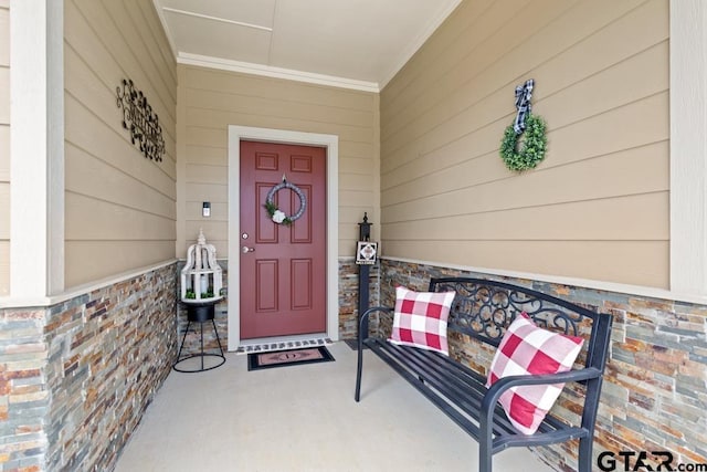 doorway to property featuring brick siding