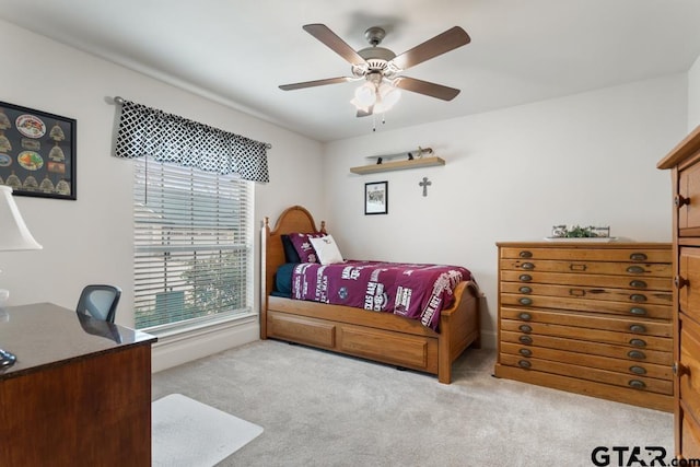 carpeted bedroom featuring a ceiling fan