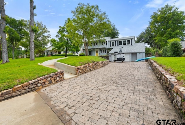 2318 S Chilton Ave, Tyler, TX 75701 - view of front of property featuring decorative driveway, a front lawn, and an attached garage