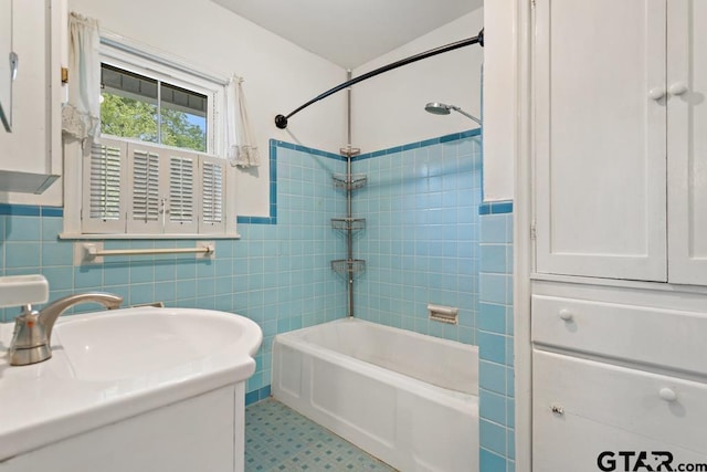 2318 S Chilton Ave, Tyler, TX 75701 - bathroom featuring bathtub / shower combination, tile walls, wainscoting, and vanity
