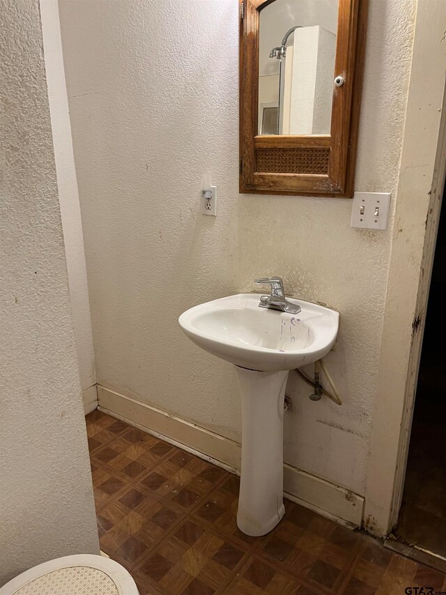 bathroom with parquet floors