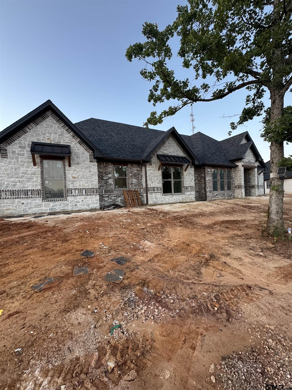 12336 Oak Grove Dr, Lindale Isd Tyler, TX 75706 - french country style house with stone siding and a shingled roof