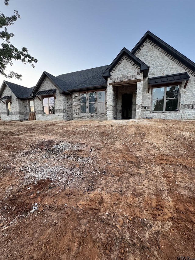 12336 Oak Grove Dr, Lindale Isd Tyler, TX 75706 - french country style house featuring stone siding, brick siding, and roof with shingles