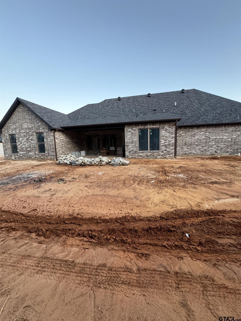 12336 Oak Grove Dr, Lindale Isd Tyler, TX 75706 - rear view of property with a shingled roof and brick siding