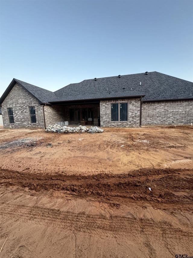 12336 Oak Grove Dr, Lindale Isd Tyler, TX 75706 - rear view of property with a shingled roof and brick siding