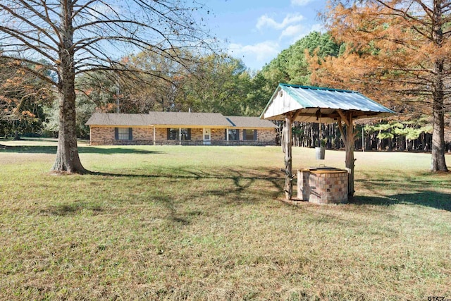 view of yard featuring central AC unit and a gazebo