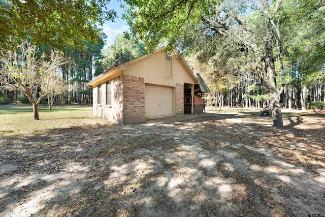 view of property exterior featuring a garage and an outdoor structure